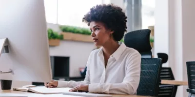 woman working at desk from nine to five